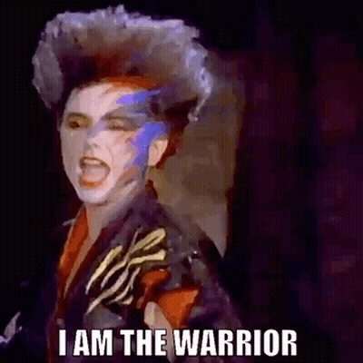 Woman With Mohawk And Painted Face Screaming GIF