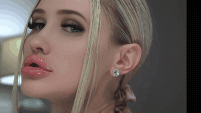 Woman With Mouth Open And Earrings Close Up GIF