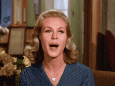 Woman With Mouth Open And Flowers GIF