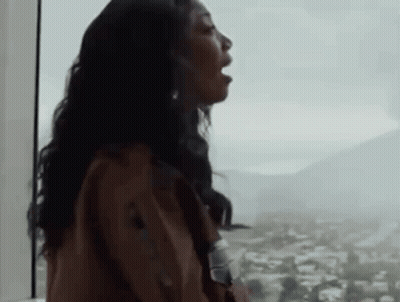Woman With Mouth Open Looking Out Window GIF