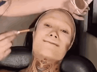 Woman With Neck Tattoo Getting Makeup Done GIF