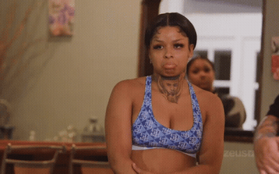 Woman With Neck Tattoo In Blue Sports Bra GIF