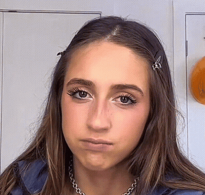 Woman With Necklace And Hair Clips GIF