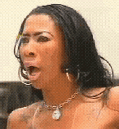Woman With Necklace And Hoop Earrings Making Funny Face GIF