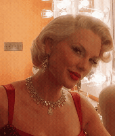 Woman With Necklace And Red Lipstick GIF