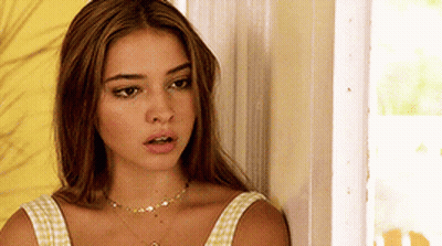 Woman With Necklace Beside Door GIF