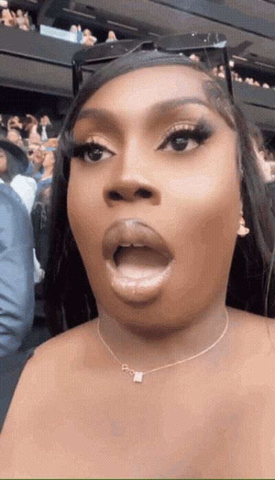 Woman With Necklace Letter N Making Funny Face GIF