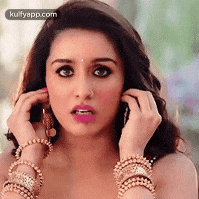 Woman With Nose Ring And Bracelets On Phone GIF