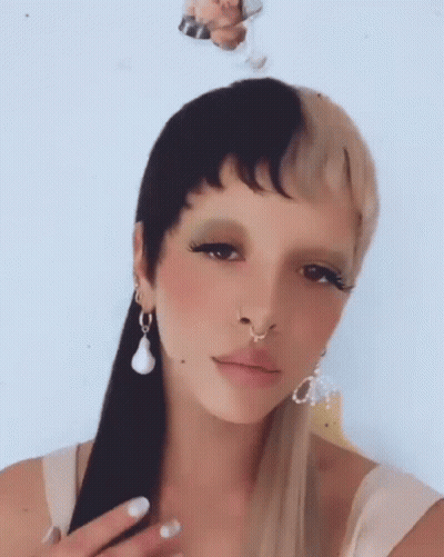 Woman With Nose Ring and Earrings and Half Black Half Blonde Hair