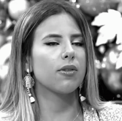 Woman With Nose Ring And Earrings Looking GIF