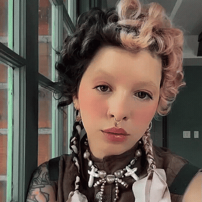 Woman With Nose Ring And Necklace With Crosses GIF