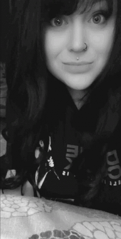 Woman With Nose Ring Smiling In Reebok Shirt GIF