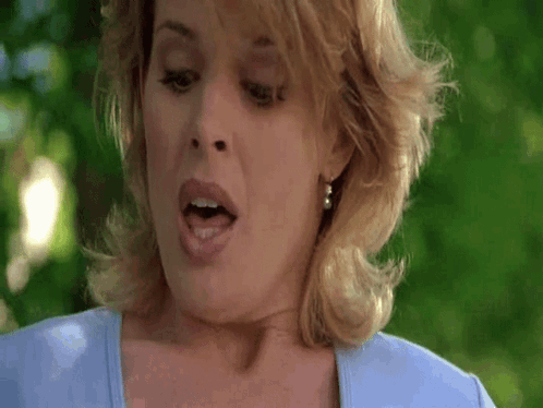Woman With Open Mouth And Blue Shirt GIF