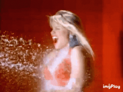 Woman With Open Mouth Being Sprayed GIF