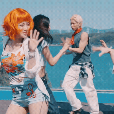 Woman With Orange Hair Dancing With Man And Woman GIF