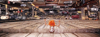 Woman With Orange Hair Next To Ambulance Sign GIF