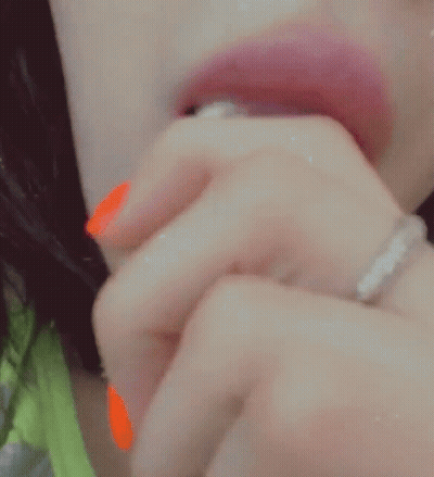 Woman With Orange Nail Polish Eating Popsicle GIF