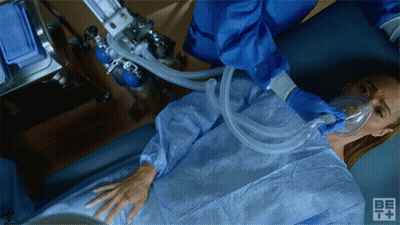Woman With Oxygen Mask In Hospital Bed GIF