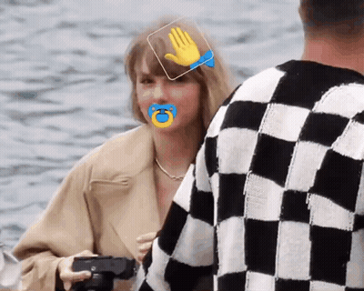 Woman With Pacifier Beside Man In Checkered Sweater GIF