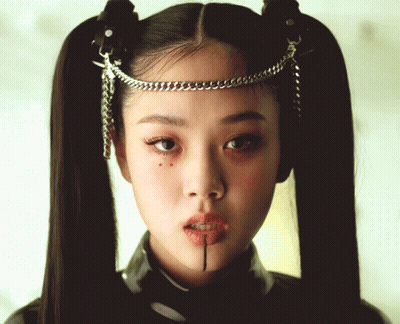 Woman With Pigtails And Chain Around Head GIF