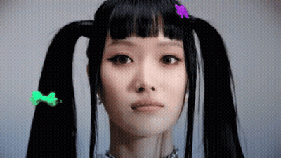 Woman With Pigtails And Colorful Hair Clips GIF