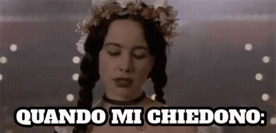 Woman With Pigtails And Flower Crown Saying Quando Mi Chiedono GIF