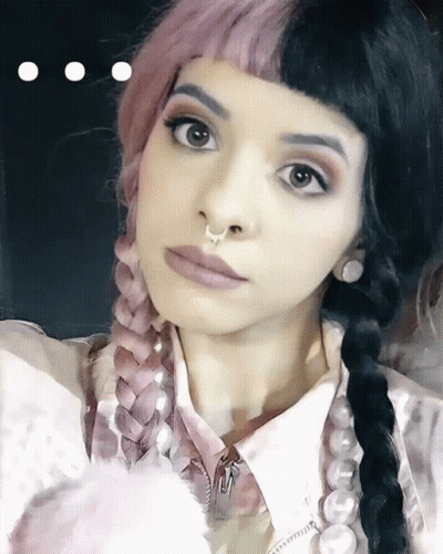 Woman With Pigtails And Nose Ring GIF