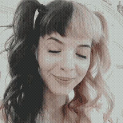 Woman With Pigtails Eyes Closed GIF