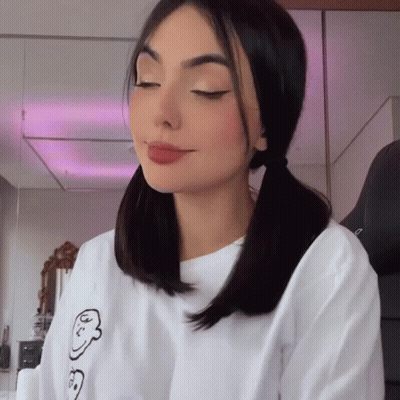 Woman With Pigtails In Face Shirt GIF