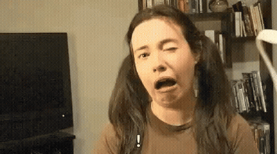Woman With Pigtails Making Funny Face GIF