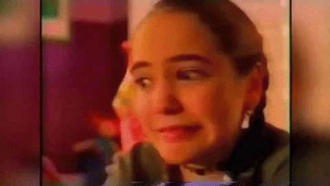 Woman With Pigtails Making Funny Face In Advertisement GIF