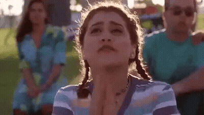 Woman With Pigtails Making Funny Face GIF