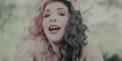 Woman With Pink And Black Hair Smiling And Flower Crown GIF