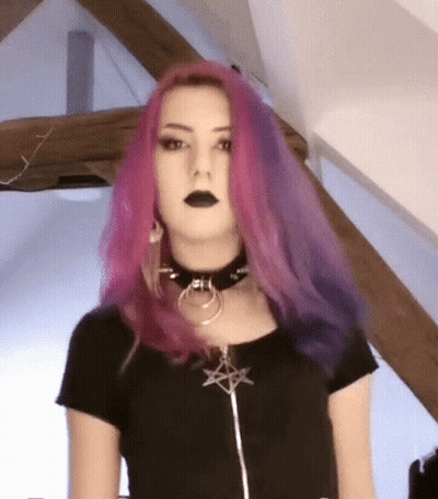 Woman With Pink And Purple Hair In Black Choker And Shirt GIF