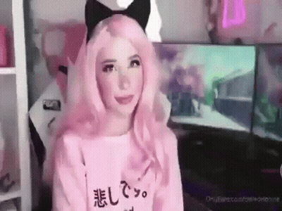Woman With Pink Hair And Cat Ear Headband Sitting At Computer GIF