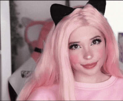 Woman With Pink Hair And Cat Ears In Pink Sweater GIF