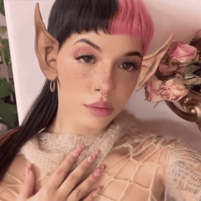 Woman With Pink Hair And Elf Ears Selfie Flowers GIF