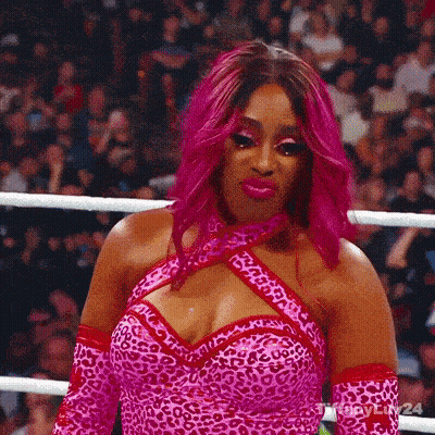 Woman With Pink Hair And Leopard Print Dress GIF