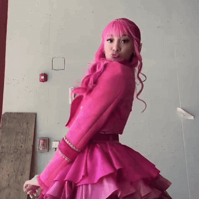 Woman With Pink Hair And Pink Dress Making Funny Face GIF