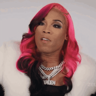 Woman With Pink Hair And Queen Necklace GIF