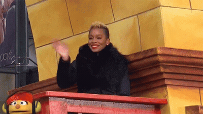 Woman With Pink Hair And Red Rose Hat GIF
