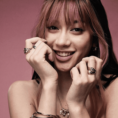 Woman With Pink Hair And Rings GIF