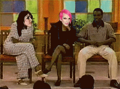 Woman With Pink Hair Between Two Men GIF