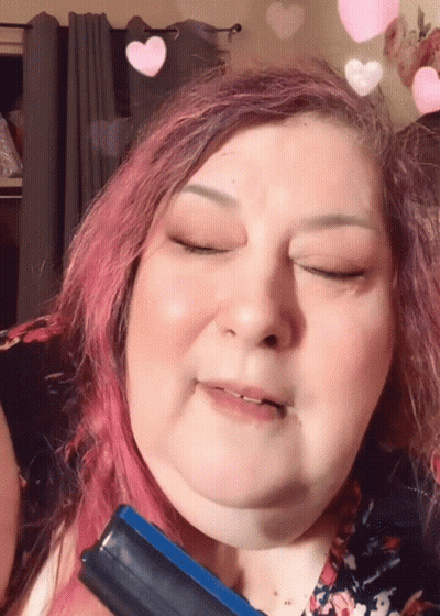 Woman With Pink Hair Holding Blue Brush GIF
