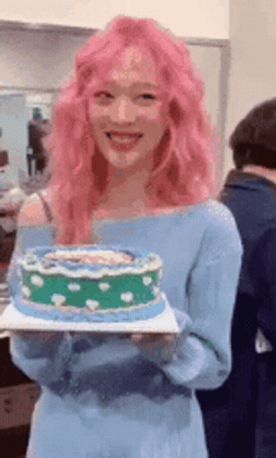 Woman With Pink Hair Holding Cake GIF