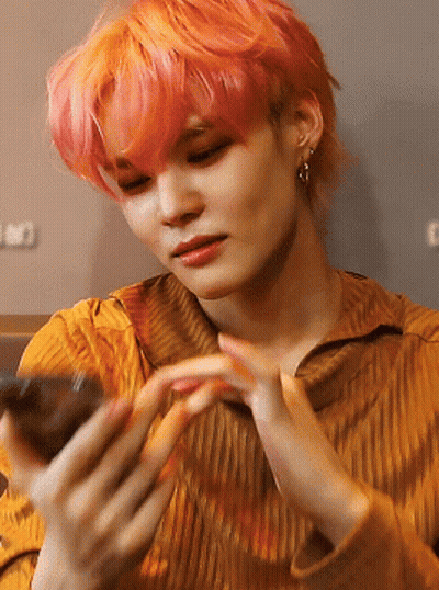 Woman With Pink Hair Holding Cell Phone GIF