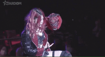 Woman With Pink Hair Holding Tiger Mask Flipping Off GIF