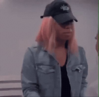 Woman With Pink Hair In Denim Jacket GIF