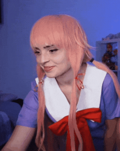 Woman With Pink Hair In Purple And White Shirt GIF
