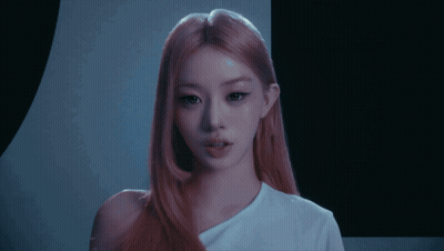 Woman With Pink Hair in White Shirt With Letter A